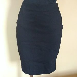 High-waist, stretchy pencil skirt with zipper.